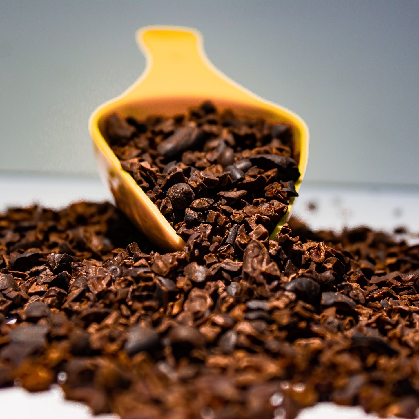 Cocoa nibs spilled on a table