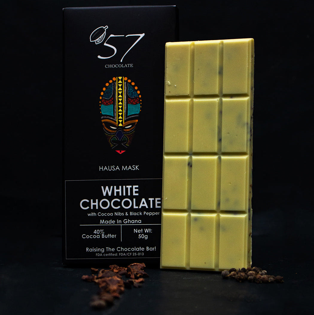 White chocolate bar with packaging labeled '57 Chocolate' on a dark background