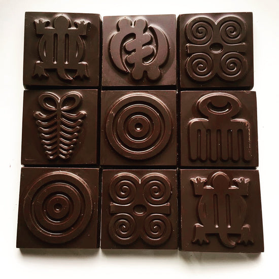 Dark chocolate with adinkra symbols from Ghana.
