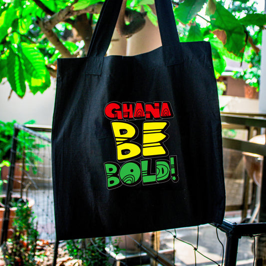 A tote bag with Ghana Be Bold on the front