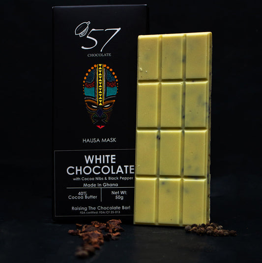 White chocolate bar with packaging labeled '57 Chocolate' on a dark background