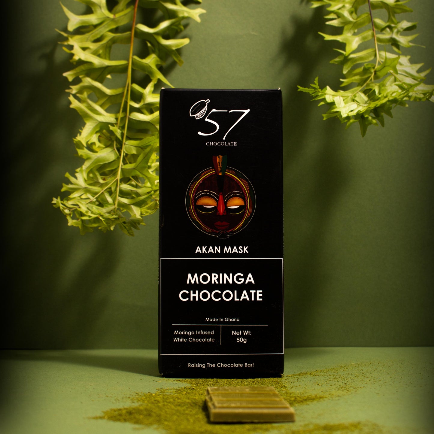 Moringa chocolate bar with packaging on a green background